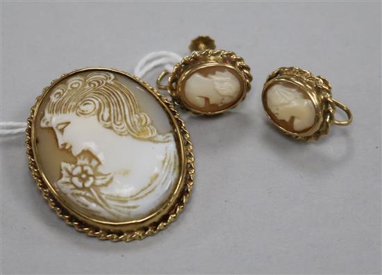 A 9ct gold-mounted cameo brooch and a similar pair of ear clips.